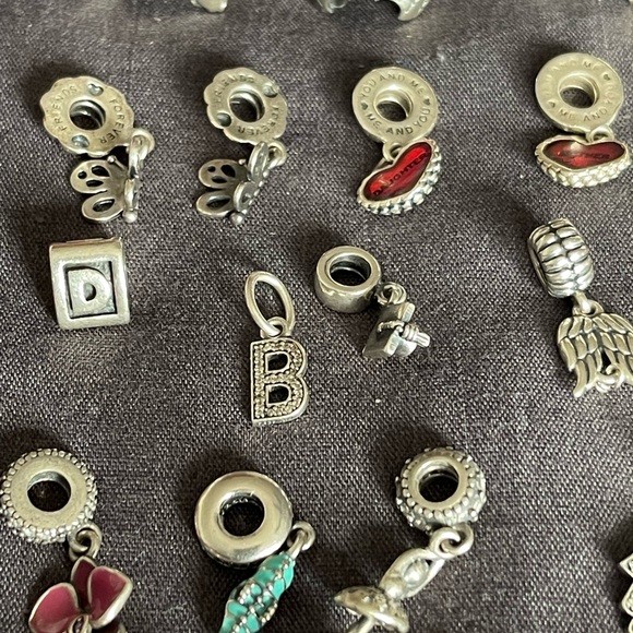 Lot of 26 Authentic Pandora charms.